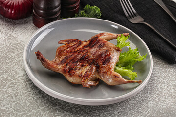 Grilled quail in the plate