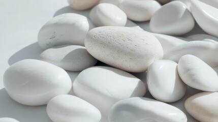 Fototapeta premium A close-up of smooth, polished white pebbles in soft light