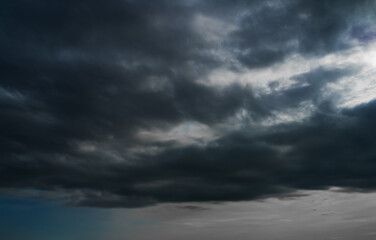 Obraz premium Cloud storm sky dark halloween background rain lightning thunder stoumy typhoon Nature light scene rainy atmosphere damage effect carbon dioxide dust air pollution 2.5 Pm, texture nature windstorm.