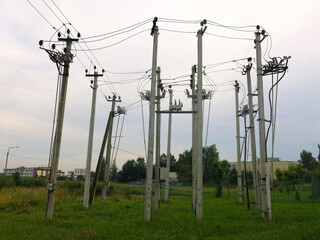 many power poles on the edge of the city