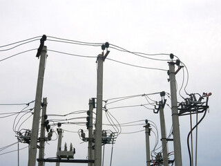 many power poles on the edge of the city