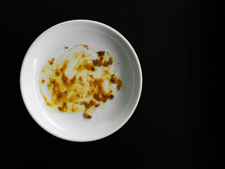 Dirty plate top view background, finished eat dinner in restautant, abstract textuer stain smearing drip sauce bbq jam chilli jelly on ceramic breakfast, concept for clean hyginene product.