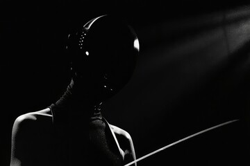 Silhouetted Fencer With Mask And Foil