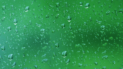 Abstract water drops on the glass surface.