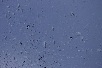 Abstract background of water drops on a window.