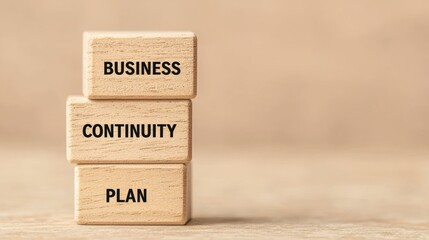 Obraz premium Business Continuity Plan Displayed on Stacked Wooden Blocks for Corporate Strategy