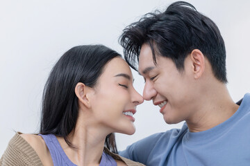 Couple enjoying a moment of intimacy while smiling and sharing joy at each other