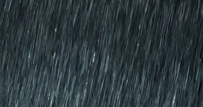 4K high-speed angled heavy rainstorm on a black surface, dynamic splashing of raindrops. High-end rain closeup VFX insert, a powerful weather element, showcasing the intense realism of the rain. 
