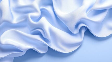 Obraz premium Soft, light blue silk fabric draped elegantly.
