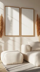 Fototapeta premium Minimalist interior with two blank frames in a Scandinavian design, featuring light colors and natural elements like dried pampas grass.