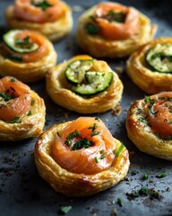 Fototapeta premium Delicious salmon and zucchini puff pastries garnished with herbs, capturing a gourmet experience.