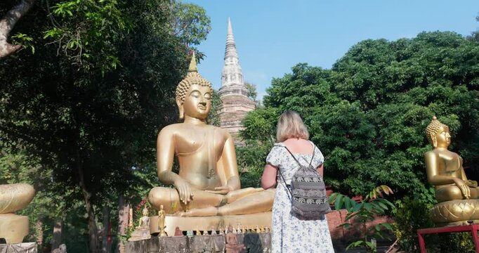A young female tourist in the ancient city Chiang Saen in Thailand