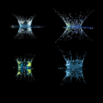 Set of four blue splashes of water drops on black background