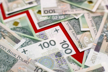 Graph of depreciation. Red graph, Polish cash banknotes, one hundred zloty. Economics and business.
