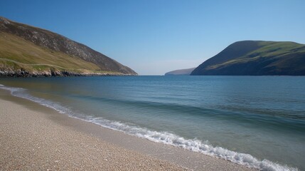 A calm beach with a single set of waves breaking onto the shore.