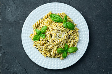 Pasta with basil sauce pesto . Italian food photography . Top view