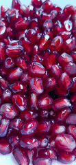 Bright red pomegranate seeds.
A pile of ripe, peeled pomegranate seeds.