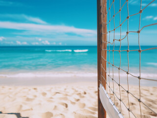 Volleyball net on a tropical beach with blue sky and ocean