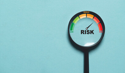 Risk level indicator rating since low to high inside of magnifier glass for Risk management and assessment con