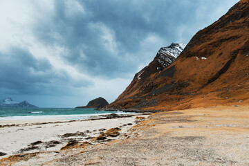 Scenic Coastal Landscape with Mountains and Cloudy Sky