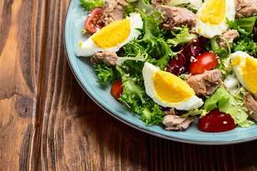 Canned Tuna salad with eggs and tomatoes photography . Top view