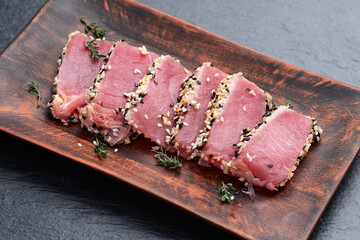 Sliced tuna steak with sesame photography . Top view