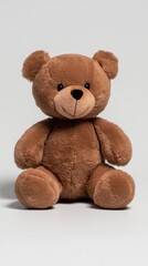 Obraz premium A cute, fluffy teddy bear is sitting isolated against a white background, showcasing its soft texture and friendly appearance.