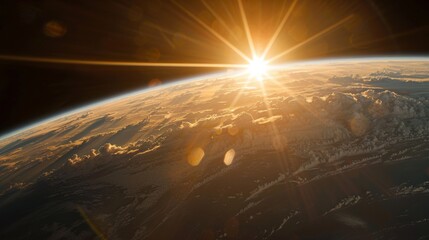 Sunlight climbing over Earth's edge casting a radiant glow