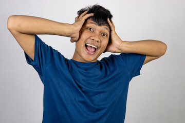 Surprised Asian man wearing blue t-shirt with. isolated on white background