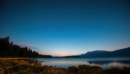 Night sky over serene lake, mountain backdrop, peaceful scene, ideal for travel brochures