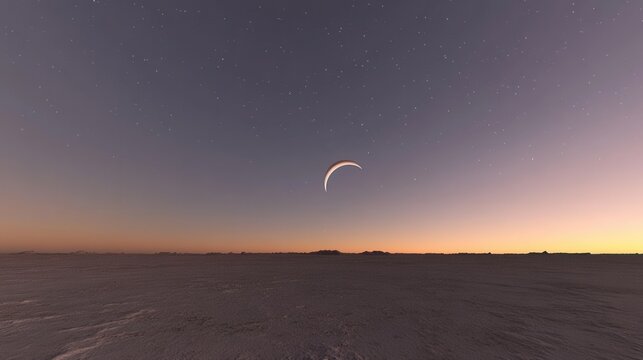 A crescent moon hangs in the twilight sky over a vast desolate landscape. Ideal for sci-fi or fantasy projects.