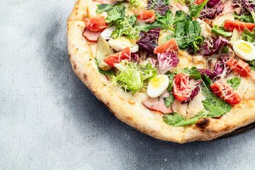 Italian pizza caesar with eggs salad chicken tomatoes and mozzarella photography. top view