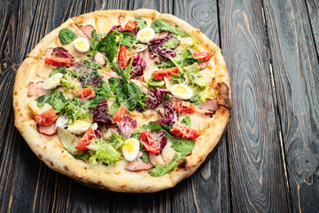 Italian pizza caesar with eggs salad chicken tomatoes and mozzarella photography. top view