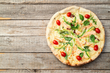 Italian pizza with avocado salmon  tomatoes and mozzarella photography. top view