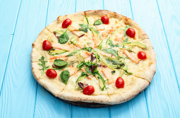 Italian pizza with avocado salmon  tomatoes and mozzarella photography. top view