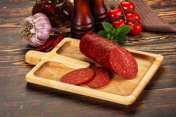 Spicy pepperoni sausages with sliced piece