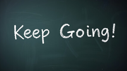 Obraz premium “Keep Going” text in a motivational chalk font on a school blackboard background.&nbsp;Generative AI