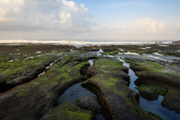 Rocky coast with tidal pools and ocean, Bali, Indonesia