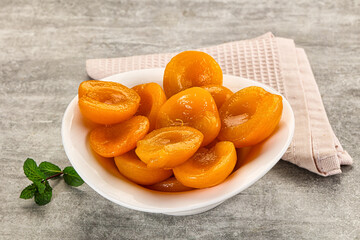 Sweet canned apricots with syrope