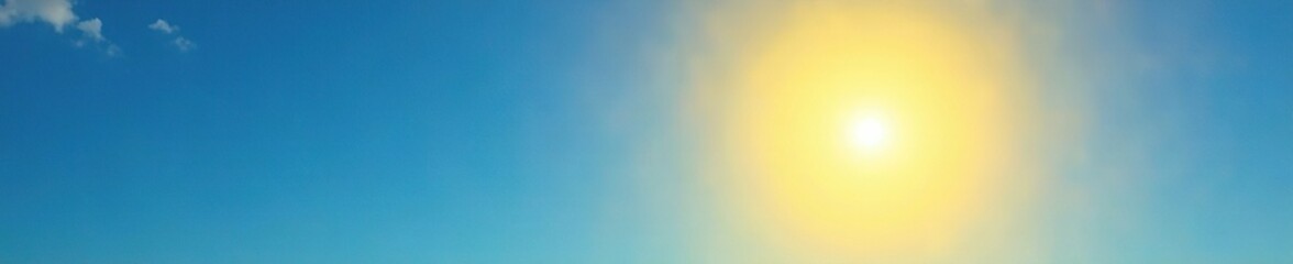 Obraz premium Yellow sun shines brightly in the clear blue sky, sun, sky