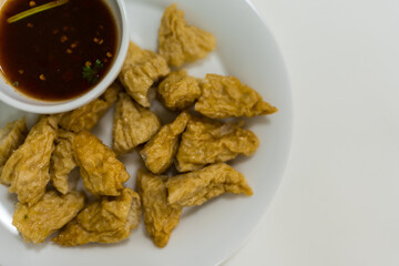 Fried fish balls served with simmered sugar dipping sauce with chili, Thai appetizer. Top view