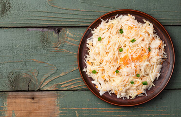 Tasty marinated cabbage with carrot, healthy food  Sauerkraut photography . Top view