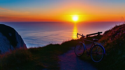 Fototapeta premium A lone bicycle leans against a weathered wooden fence, its silhouette stark against the glowing backdrop.