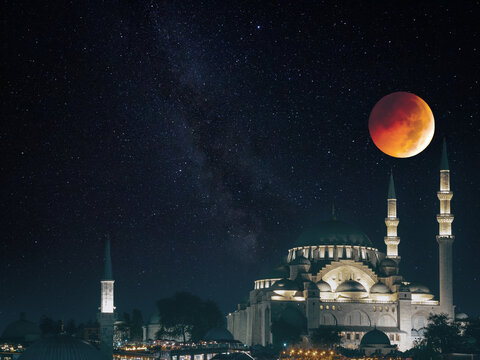 Mosques with starry night and eclipsed moon. Ramadan or islamic concept