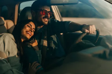 Driving into the sunset. A couple enjoying the freedom of the open road