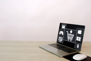 Online shopping concept.,Laptop with shopping cart on screen showcasing digital retail platforms, e-commerce.