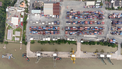 A large container ship is docked at a port