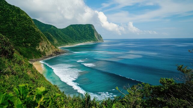 Amami Island coastal landscape with waves crashing on lush green hills under a clear blue sky showcasing pristine tropical waters.