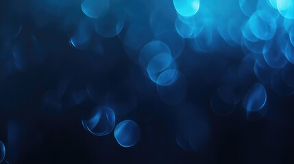 Dark blue abstract bokeh light background creating a serene and atmospheric effect ideal for presentations and graphic design projects