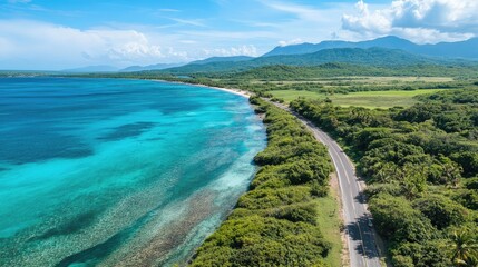 Fototapeta premium Aerial Perspective of Lush Tropical Coastline and Scenic Highway with Serene Blue Waters and Mountain Backdrop